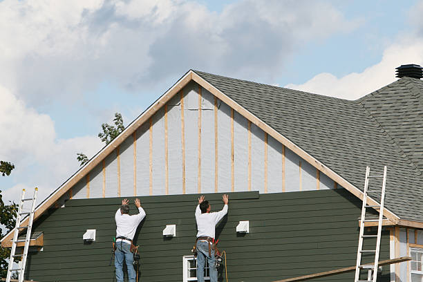 Professional Vinyl Siding technician working in Sharon, MA